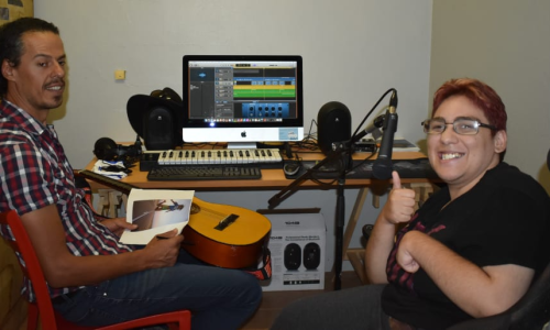 Photo of Steve Carillo and Amy James working on Amy’s music compilations.